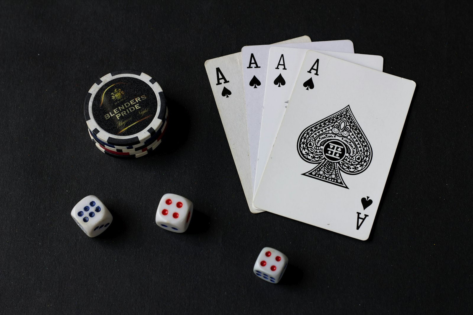 Cards and dice laid out on a dark surface